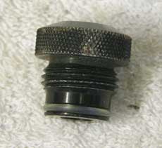 male asa to female 1/8th npt, round knurled top used with wrench marks, good shape