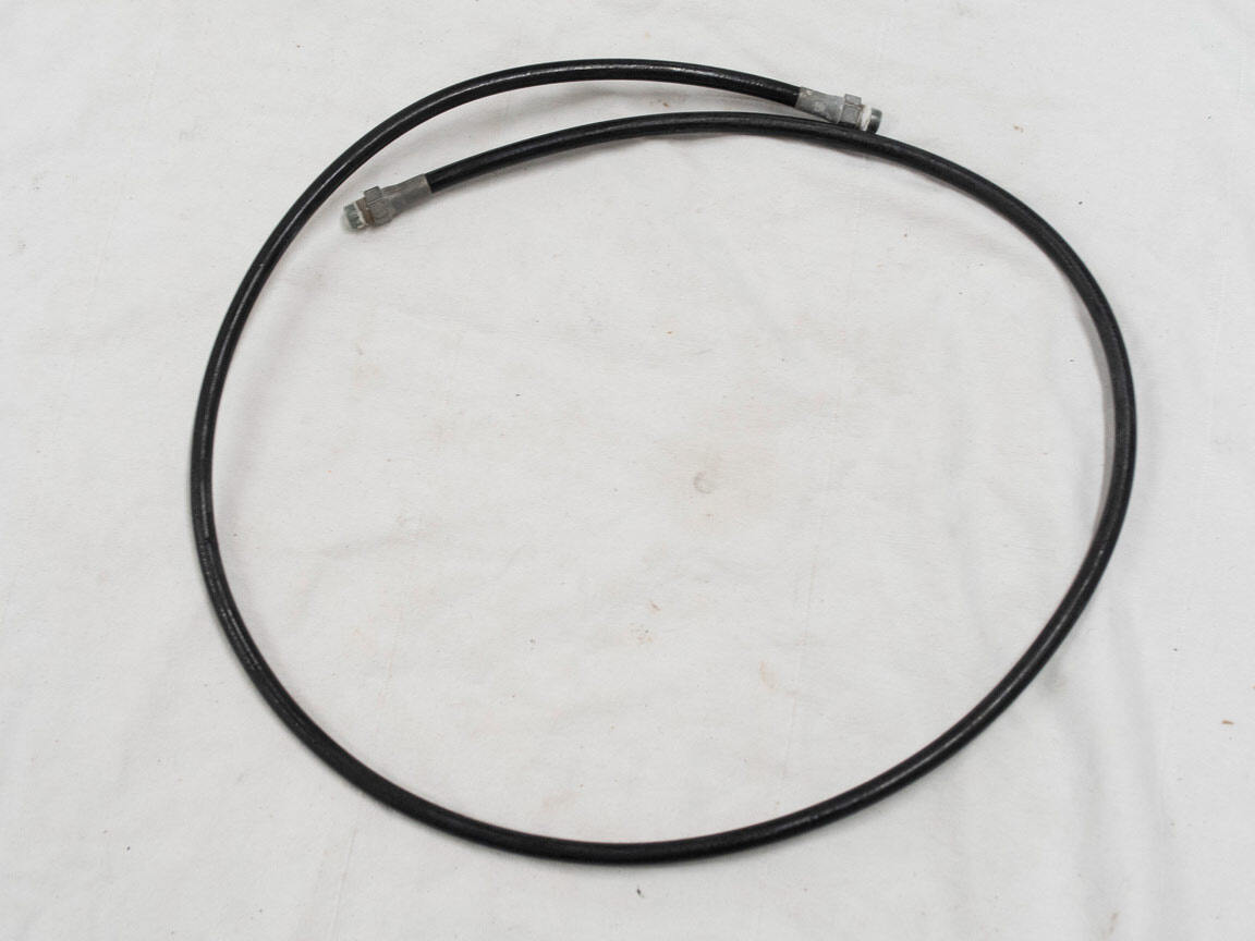 Black plastic hose, roughly 47 inches.