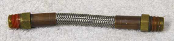 4” steel braided hose, good shape, brass ends