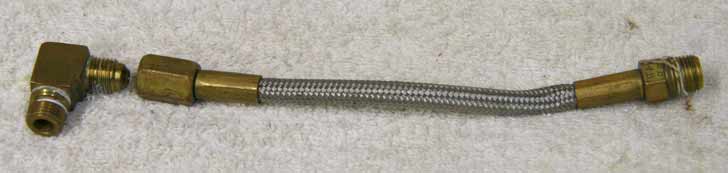 6.5” steel braided hose, brass with one side tighten to seal fitting, measured end to end, used good shape