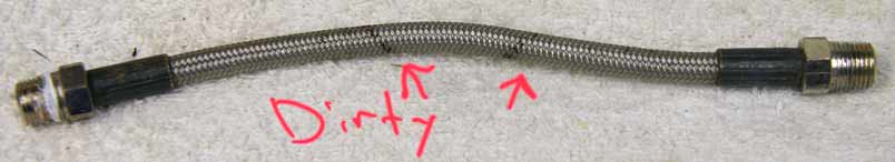 7” steel braided hose, used good shape, thinner than standard and light wrench marks on ends