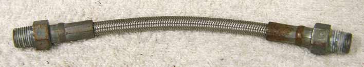 5.75” steel braided hose, decent shape but has rust on ends, see pics