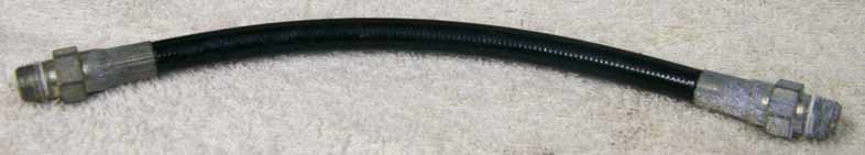 Old 8” black plastic hose, 2500psi rated would not recommend over 800 psi, good shape, ends are lightly corroded