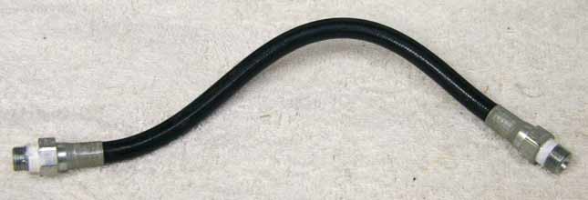 Old 9.5” black plastic hose, 2500psi rated would not recommend over 800 psi, used good shape, has bend to it
