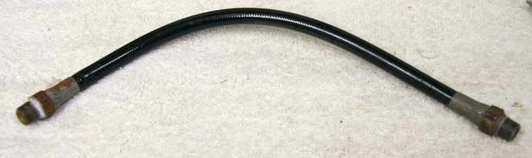 Old 11” black plastic hose, 2500psi rated would not recommend over 800 psi, used shape, has bend in it