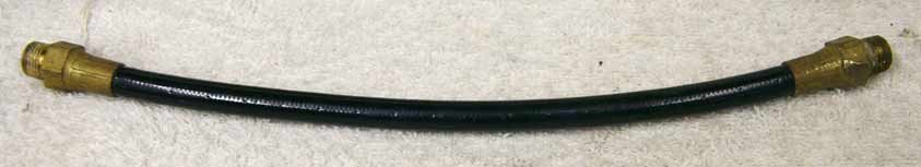 Old 9.25” black plastic hose, 2500psi rated would not recommend over 800 psi, used shape, brass ends have wrench marks
