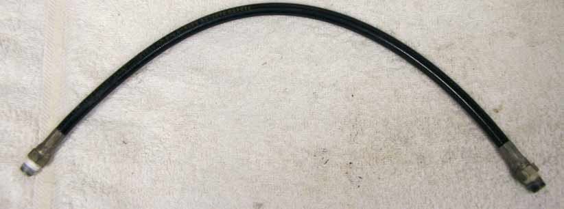 Old 16.25” black plastic hose, 2500psi rated would not recommend over 800 psi, used decent shape