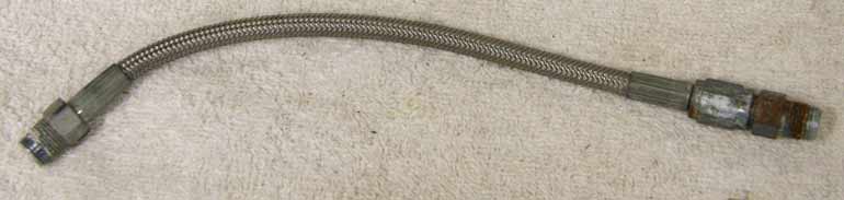 8.875” steel braided hose, used decent shape, tighten to seal end on one side but corroded/rusty, should work fine