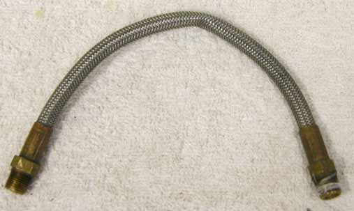 8.5” steel braided hose with brass ends in used decent shape, but has kink in center!