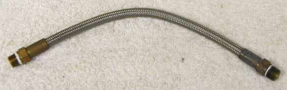 8.75” steel braided hose with brass ends in good shape light corrosion on brass ends