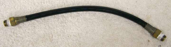 Old 9.5” black plastic hose, 2500psi rated would not recommend over 800 psi, good shape, light wrench marks on ends