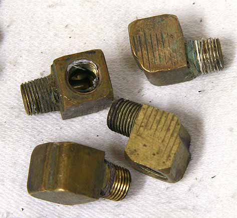 used shape brass 90 degree 1/8th inch npt fitting, One included.