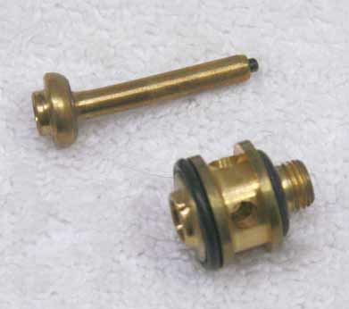 Brass autococker valve. Cup seal looks good but face has giant ding.