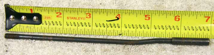 6.875 inch old school pump arm rod, steel with rust, used shape, has wrench marks