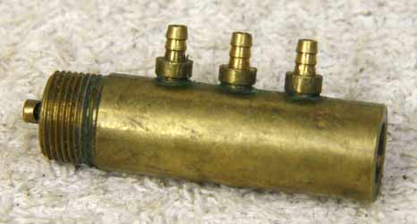 WGP Autococker stock brass 3 way used and tarnished, round barb