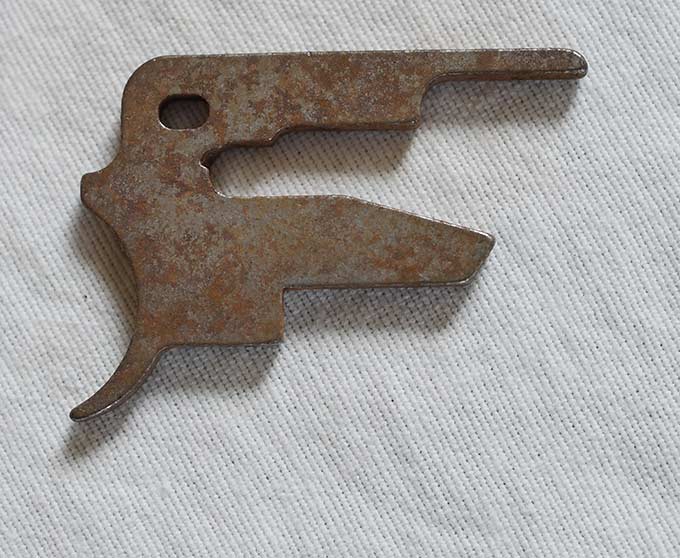 Post 98 steel trigger plate, with rust, used shape, not plated.