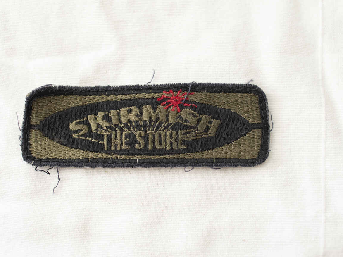 Older Skirmish the store team patch, staining on back