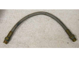 8.75” steel braided hose with brass ends in used decent shape, dirty