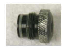 male asa to female 1/8th npt, round knurled top used with wrench marks, bad shape