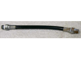 Old 7” black plastic hose, 2500psi rated would not recommend over 800 psi, used decent shape, ends have rust