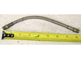 8.75” steel braided hose, used shape with lots of wrench marks and dirty but has threaded inside on either end for filter screw ins