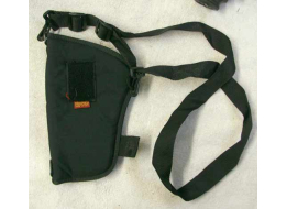 Black holster, with shoulder harness, missing velcro to hold trigger in