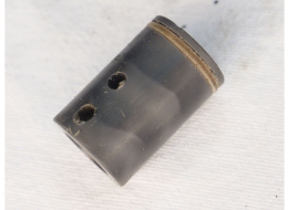 Prolite delrin bolt in used shape, two holes drilled