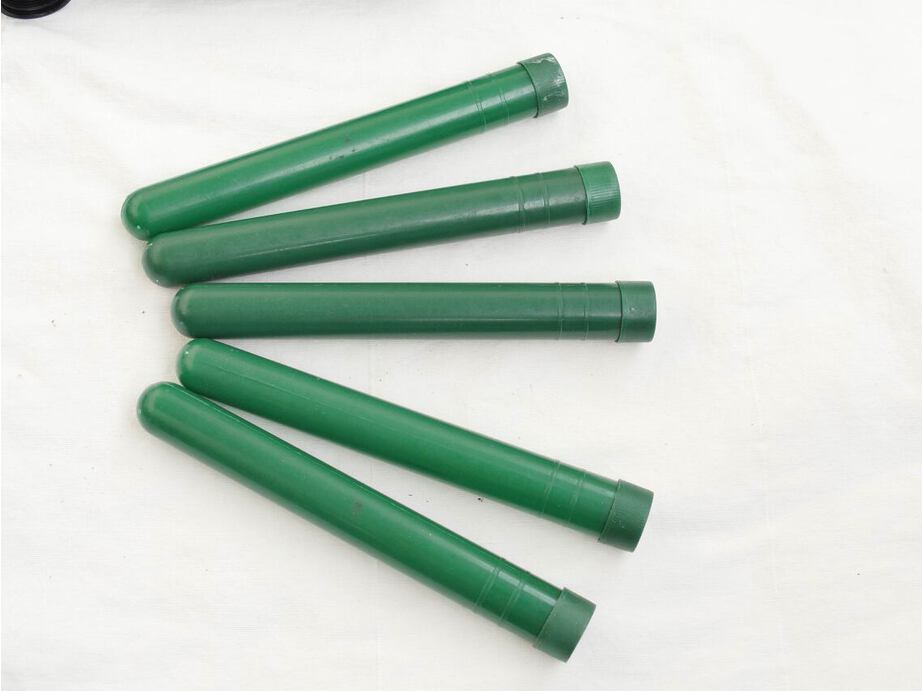 5 Green tubes with caps, used but decent shape, no cracks