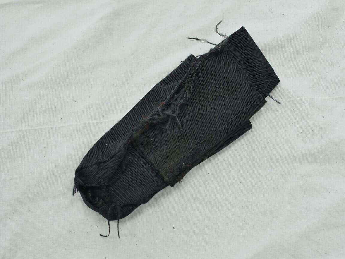 Ripped up pouch, maybe for remote line on 7oz?