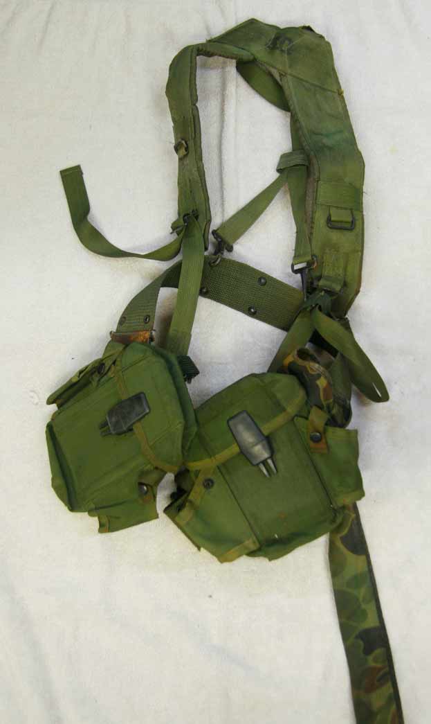 army surplus suspenders with pouches? Has squeegie holder attached, used and heavy