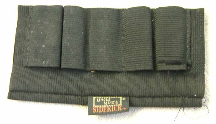 Uncle Mikes Sidekick rifle stock 12 gram or tube holder, used but decent shape, elastic holds shape