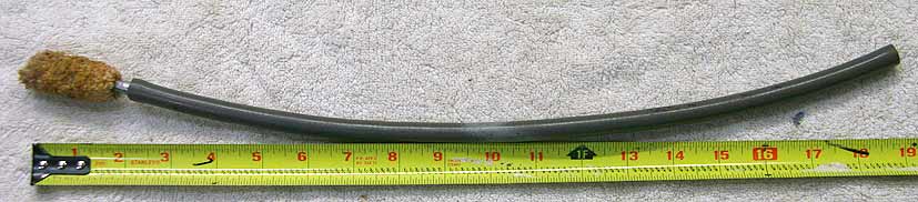 Grey ~19 inch taso possum tail squeegie, missing disc end, used