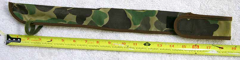 Camo squeegie belt holder, used, has hole in bottom with velcro to attach to leg strap