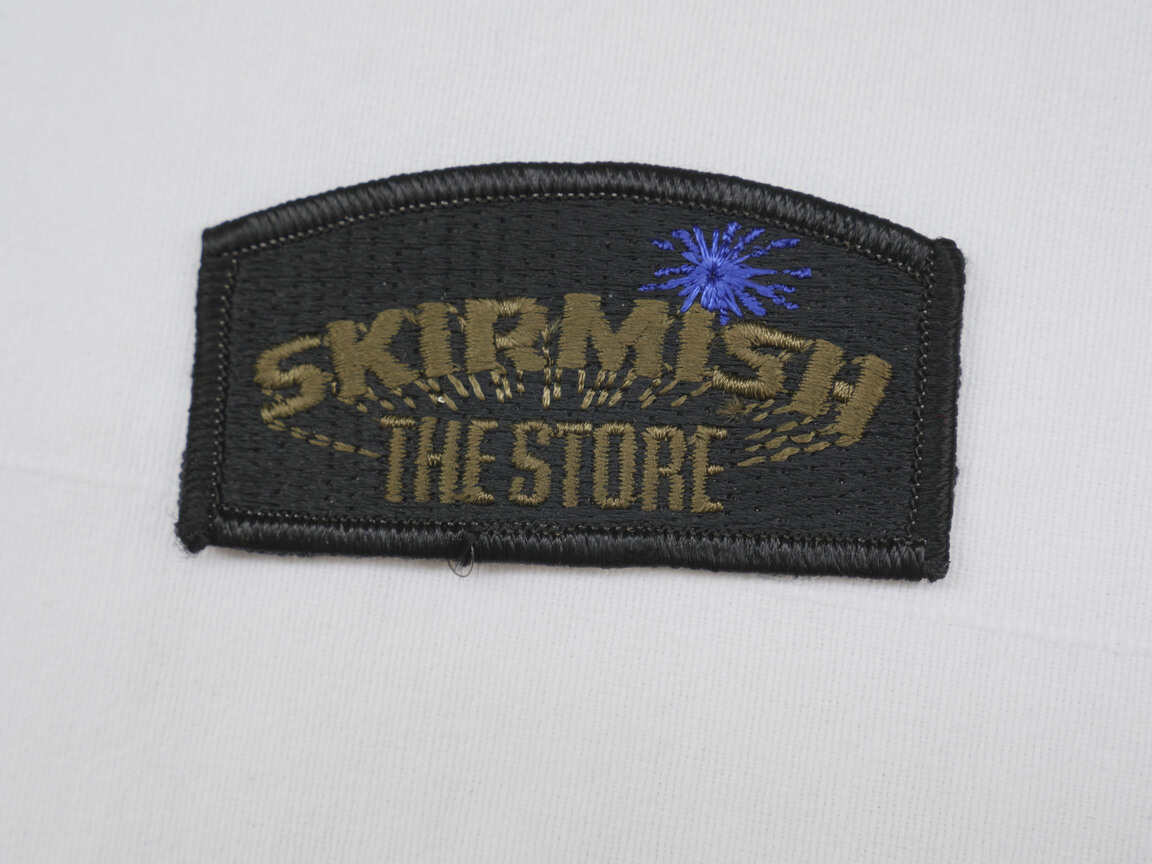 Skirmish the Store patch, unused with blue splat