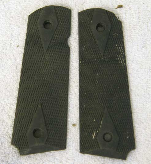 Pearce 45 grip panels in used shape, dirty, plastic is between hard and soft