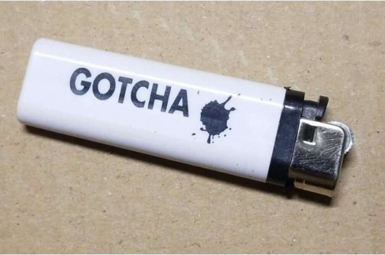 Gotcha Lighter. Unsure of country