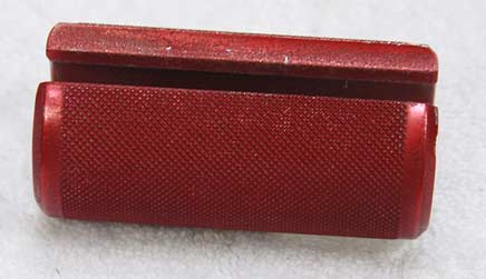 Red anodized aluminum knurled pump handle, bad condition.