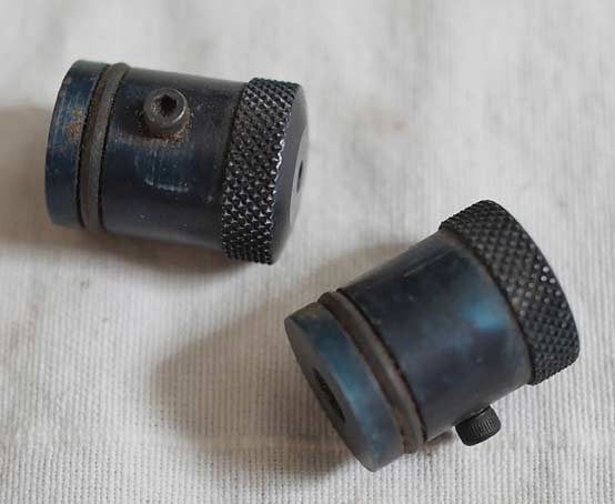 Discolored blue Sheridan PGP and PMI 1 back plug. With screw