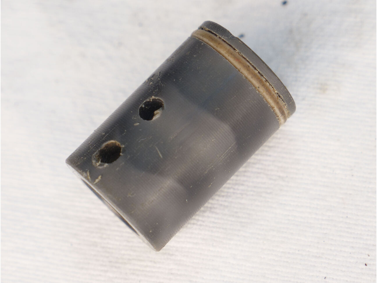 Prolite delrin bolt in used shape, two holes drilled
